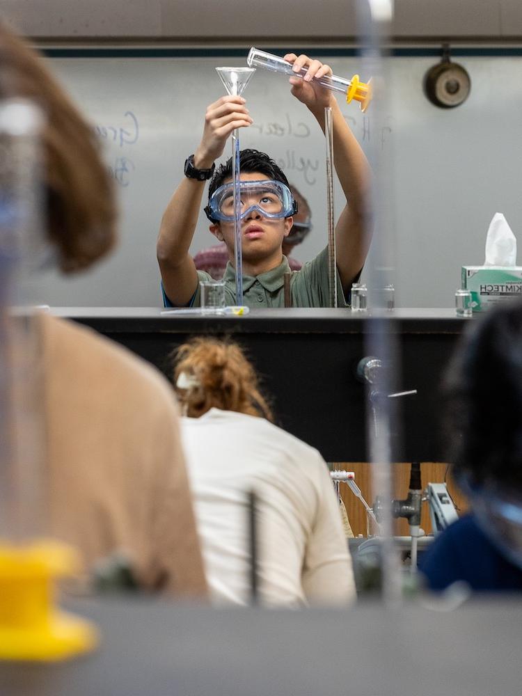 Student conducting chemistry experiment